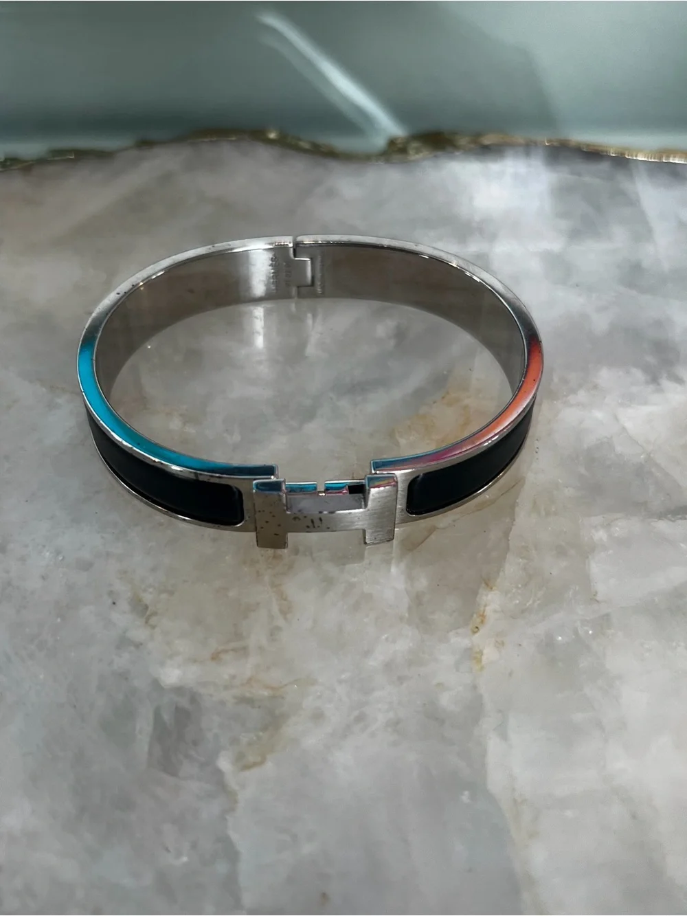 Hermes Silver-Tone Bracelet with Black Enamel H Detail
